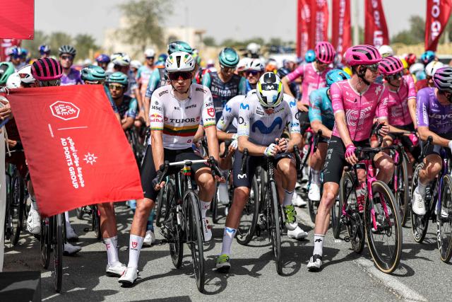 Riders wait at the start line before the first stage of the UAE Tour cycling event from Madinat Zayed Majlis to Liwa Palace in Abu Dhabi on February 16, 2026. (Photo by Fadel SENNA / AFP)