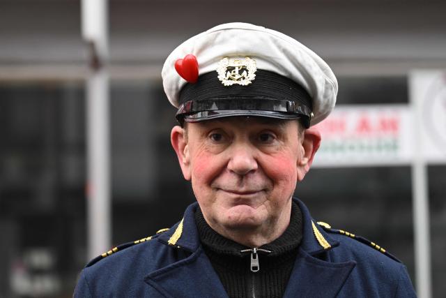German carnival float builder Jacques Tilly poses for photographers during the parade to celebrate Rose Monday (Rosenmontag), on February 16, 2026 in Duesseldorf, western Germany. (Photo by INA FASSBENDER / AFP)