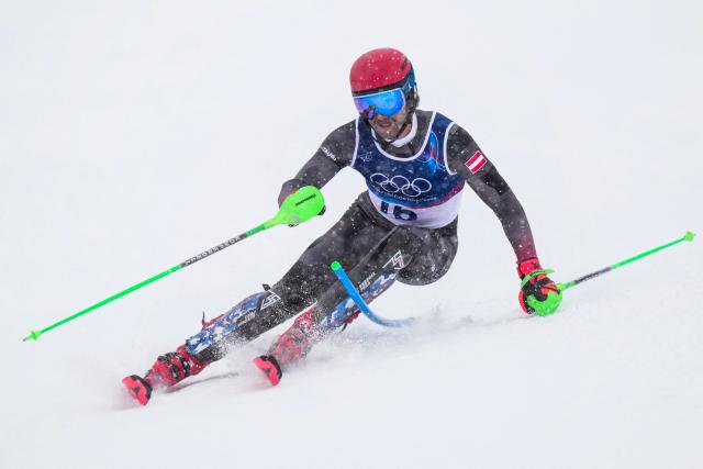 Austria's Marco Schwarz competes in the first run of the men's slalom alpine skiing event during the Milano Cortina 2026 Winter Olympic Games at the Stelvio Ski Centre in Bormio (Valtellina) on February 16, 2026. (Photo by Dimitar DILKOFF / AFP)