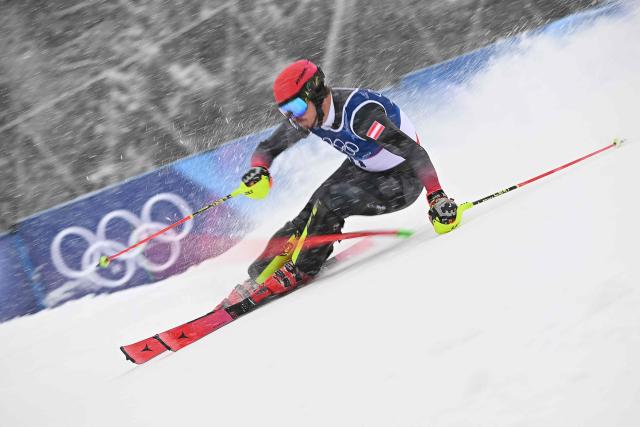Austria's Manuel Feller competes in the first run of the men's slalom alpine skiing event during the Milano Cortina 2026 Winter Olympic Games at the Stelvio Ski Centre in Bormio (Valtellina) on February 16, 2026. (Photo by Fabrice COFFRINI / AFP)