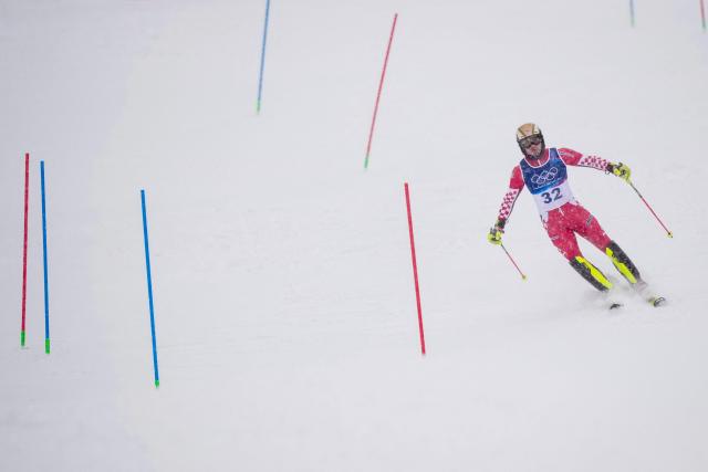 Croatia's Istok Rodes skis out in the first run of the men's slalom alpine skiing event during the Milano Cortina 2026 Winter Olympic Games at the Stelvio Ski Centre in Bormio (Valtellina) on February 16, 2026. (Photo by Dimitar DILKOFF / AFP)