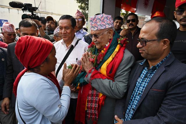 Khadga Prasad Sharma Oli (C), Nepal's former prime minister and Communist Party of Nepal-Unified Marxist Leninist (CPN-UML) leader, speaks to supporters during a door-to-door election campaign rally in Damak, Jhapa district on February 16, 2026. Nepali candidates launch their campaigns on February 16 for March 5 parliamentary elections, the first since deadly anti-corruption protests toppled the previous government in 2025. (Photo by Prakash MATHEMA / AFP)