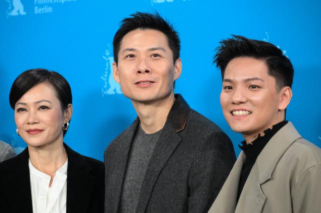 (L-R) Malaysian actress Yeo Yann Yann, Singaporean director Anthony Chen and Singaporean actor Koh Jia Ler pose during a photo call for the film "Wo Men Bu Shi Mo Sheng Ren" (We Are All Strangers) presented in competition at the 76th Berlinale, Europe's first major film festival of the year, in Berlin on February 16, 2026. (Photo by RALF HIRSCHBERGER / AFP)