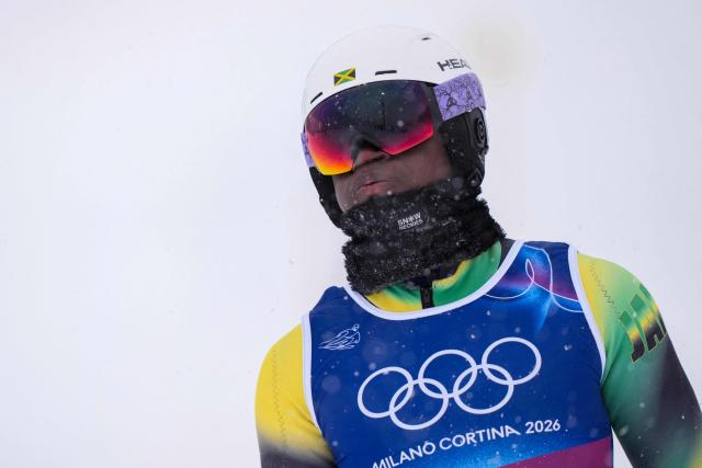 Jamaica's Henri Rivers Iv reacts after skiing out in the first run of the men's slalom alpine skiing event during the Milano Cortina 2026 Winter Olympic Games at the Stelvio Ski Centre in Bormio (Valtellina) on February 16, 2026. (Photo by Dimitar DILKOFF / AFP)