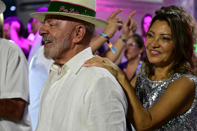 Brazil's President Luiz Inacio Lula da Silva and First Lady Janja Lula da Silva attend the Mangueira samba school parade during the opening night of the Rio Carnival at the Marques de Sapucai Sambadrome in Rio de Janeiro on February 16, 2026. (Photo by Pablo PORCIUNCULA / AFP)