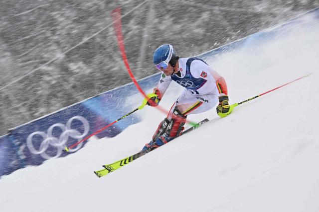 Lithuania's Andrej Drukarov competes in the first run of the men's slalom alpine skiing event during the Milano Cortina 2026 Winter Olympic Games at the Stelvio Ski Centre in Bormio (Valtellina) on February 16, 2026. (Photo by Fabrice COFFRINI / AFP)