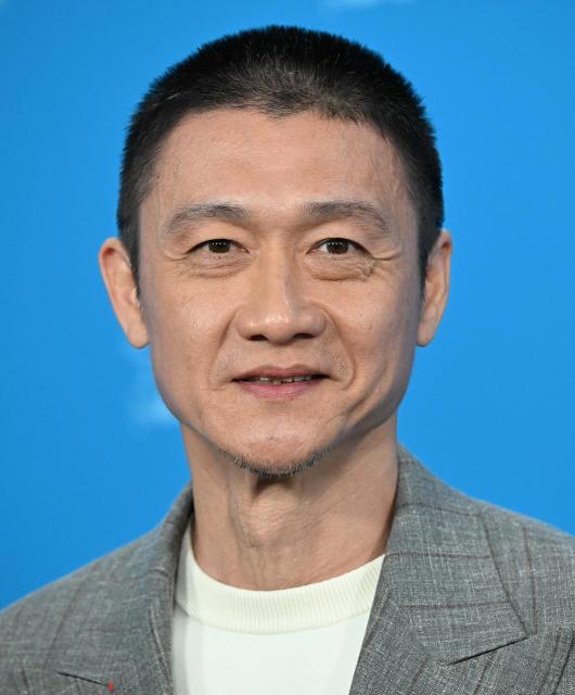 Singaporean actor Andi Lim poses during a photo call for the film "Wo Men Bu Shi Mo Sheng Ren" (We Are All Strangers) presented in competition at the 76th Berlinale, Europe's first major film festival of the year, in Berlin on February 16, 2026. (Photo by RALF HIRSCHBERGER / AFP)