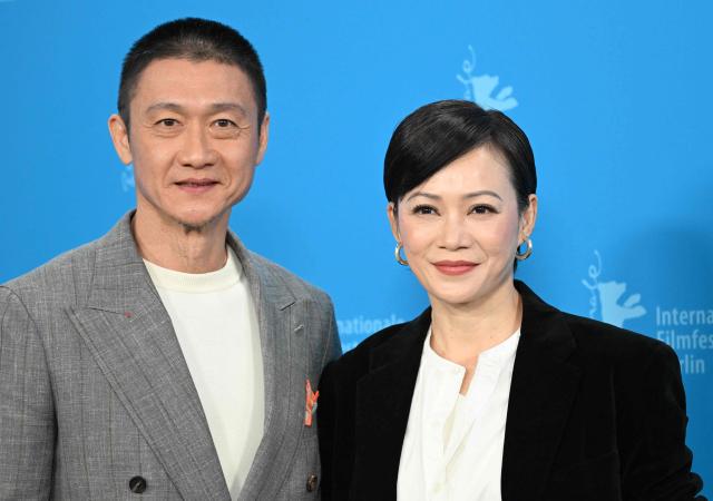 Singaporean actor Andi Lim and Malaysian actress Yeo Yann Yann pose during a photo call for the film "Wo Men Bu Shi Mo Sheng Ren" (We Are All Strangers) presented in competition at the 76th Berlinale, Europe's first major film festival of the year, in Berlin on February 16, 2026. (Photo by RALF HIRSCHBERGER / AFP)