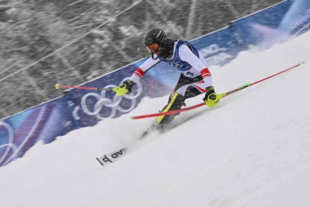 Georgia's Luka Buchukuri competes in the first run of the men's slalom alpine skiing event during the Milano Cortina 2026 Winter Olympic Games at the Stelvio Ski Centre in Bormio (Valtellina) on February 16, 2026. (Photo by Fabrice COFFRINI / AFP)