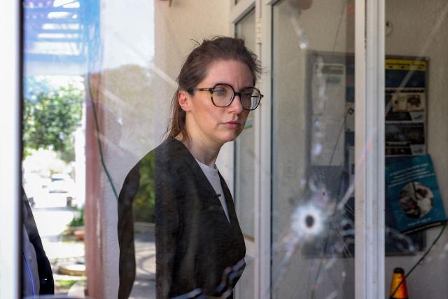 Aurore Berge, France's junior Minister in charge of equality, tours through Kibbutz Nir Oz, one of the sites of the 2023 October 7 attacks, in southern Israel on February 16, 2026. (Photo by Ilia YEFIMOVICH / AFP)