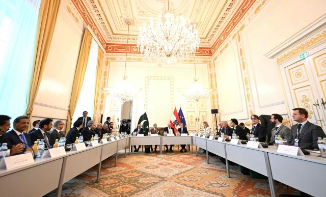 Austria's Chancellor Christian Stocker (C-R) and Pakistan's Prime Minister Shehbaz Sharif (C-L) attend a bilateral meeting during an official visit to Vienna, Austria on February 16, 2026. (Photo by HELMUT FOHRINGER / APA / AFP) / Austria OUT