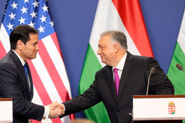 Hungary's Prime Minister Viktor Orban shakes hands with US Secretary of State Marco Rubio (L) after a joint press conference following talks during a visit in Budapest, Hungary, on February 16, 2026. (Photo by Alex Brandon / POOL / AFP)