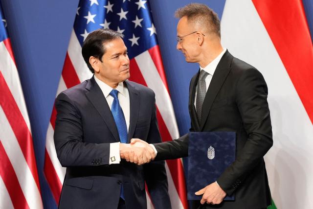 US Secretary of State Marco Rubio (L) shakes hands with Hungary's Foreign Minister Peter Szijjarto after signing the US-Hungary Intergovernmental Agreement on Civil Nuclear Cooperation in Budapest, Hungary, on February 16, 2026. (Photo by Alex Brandon / POOL / AFP)