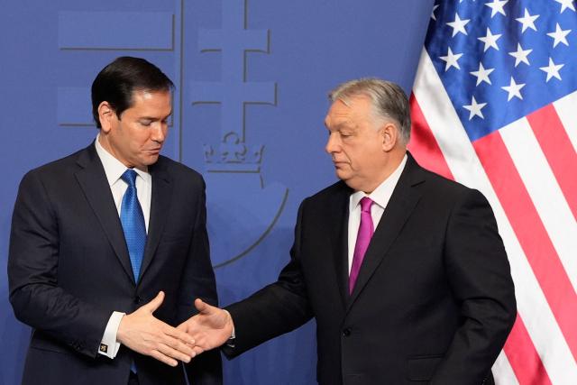 Hungary's Prime Minister Viktor Orban shakes hands with US Secretary of State Marco Rubio (L) after a joint press conference following talks during a visit in Budapest, Hungary, on February 16, 2026. (Photo by Alex Brandon / Pool AP / AFP)