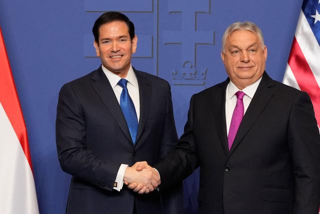 Hungary's Prime Minister Viktor Orban shakes hands with US Secretary of State Marco Rubio (L) after a joint press conference following talks during a visit in Budapest, Hungary, on February 16, 2026. (Photo by Alex Brandon / Pool AP / AFP)