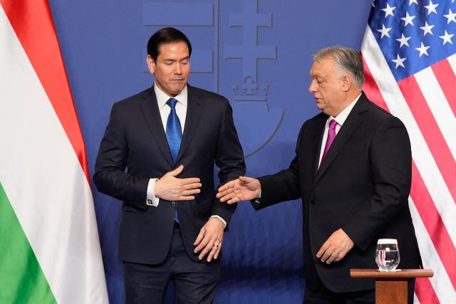 Hungary's Prime Minister Viktor Orban shakes hands with US Secretary of State Marco Rubio (L) after a joint press conference following talks during a visit in Budapest, Hungary, on February 16, 2026. (Photo by Alex Brandon / Pool AP / AFP)