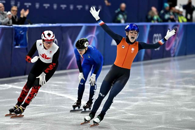 Netherlands' Xandra Velzeboer celebrates after winning gold in the short track speed skating women's 1000m final during the Milano Cortina 2026 Winter Olympic Games at Milano Ice Skating Arena in Milan on February 16, 2026. (Photo by Gabriel BOUYS / AFP)