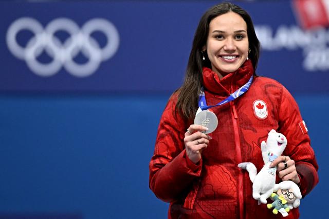 Silver medallist Canada's Courtney Sarault poses on the podium of the short track speed skating women's 1000m final during the Milano Cortina 2026 Winter Olympic Games at Milano Ice Skating Arena in Milan on February 16, 2026. (Photo by Gabriel BOUYS / AFP)