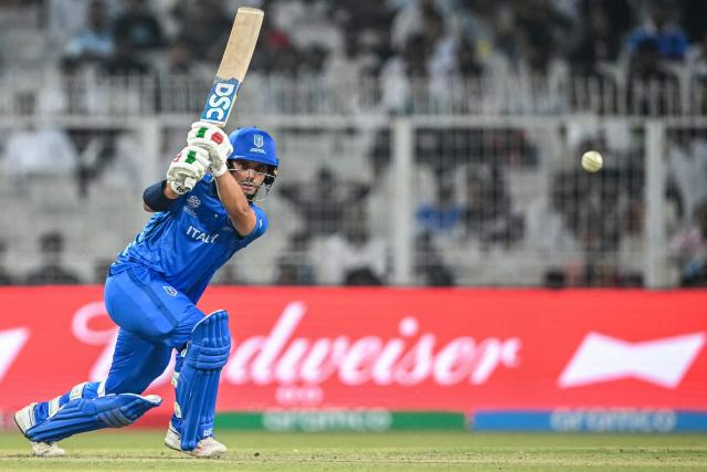 Italy's Justin Mosca plays a shot during the 2026 ICC Men's T20 Cricket World Cup group stage match between England and Italy at the Eden Gardens in Kolkata on February 16, 2026. (Photo by Dibyangshu SARKAR / AFP)