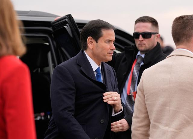 US Secretary of State Marco Rubio (C) gets off a car as he departs at the Liszt Ferenc International Airport in Budapest, Hungary, on February 16, 2026. (Photo by Alex Brandon / POOL / AFP)