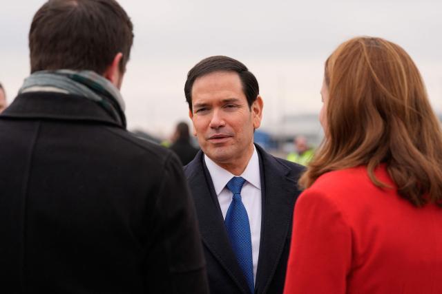 US Secretary of State Marco Rubio (C) talks to Hungary's Deputy Foreign Minister Levente Magyar and Chargй d’Affaires of the US Mission to Hungary Caroline Savage as he departs at the Liszt Ferenc International Airport in Budapest, Hungary, on February 16, 2026. (Photo by Alex Brandon / POOL / AFP)