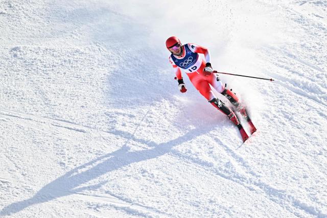 Switzerland's Tanguy Nef reacts in the finish area after competing in the second run of the men's slalom alpine skiing event during the Milano Cortina 2026 Winter Olympic Games at the Stelvio Ski Centre in Bormio (Valtellina) on February 16, 2026. (Photo by Fabrice COFFRINI / AFP)