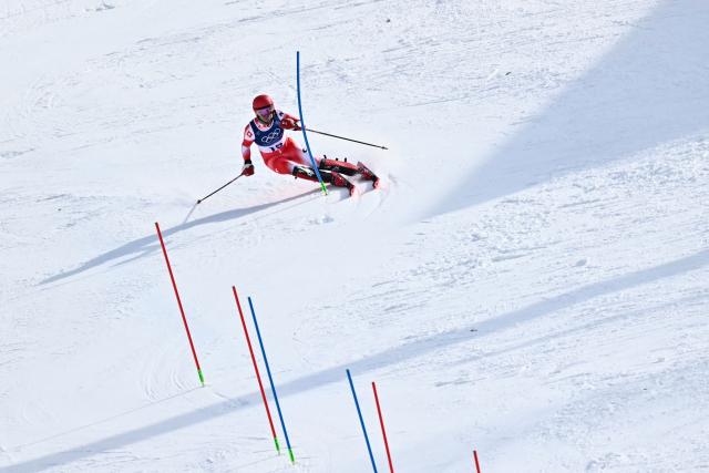Switzerland's Tanguy Nef competes in the second run of the men's slalom alpine skiing event during the Milano Cortina 2026 Winter Olympic Games at the Stelvio Ski Centre in Bormio (Valtellina) on February 16, 2026. (Photo by Fabrice COFFRINI / AFP)