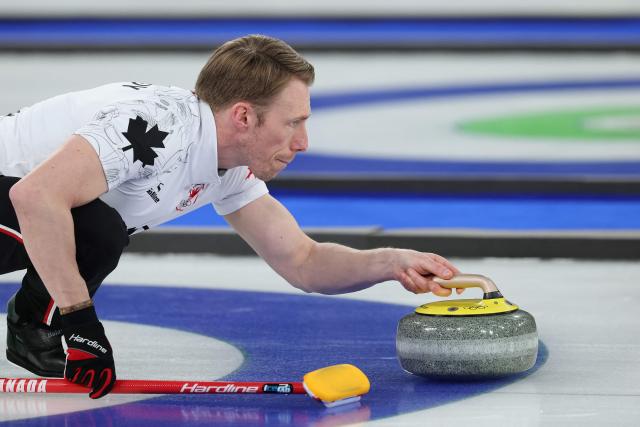 Canada's Marc Kennedy delivers the stone during the curling men's round robin between Czech Republic and Canada during the Milano Cortina 2026 Winter Olympic Games at the Cortina Curling Olympic Stadium in Cortina d’Ampezzo on February 16, 2026. (Photo by Odd ANDERSEN / AFP)