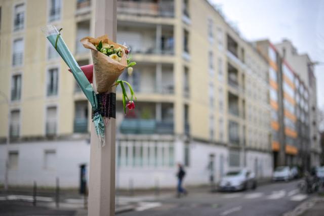 A bouquet of flowers hangs at the site of the brawl that caused the death of Quentin Deranque, a far-right activist a who died after a fatal beating, in Lyon on February 16, 2026. Quentin Deranque, 23, died of his wounds after being attacked on February 12, 2026 on the sidelines of a far-right protest against a left-wing politician speaking at a university in the city of Lyon. The incident has fuelled tension between France's far right and hard left ahead of municipal elections in March and the 2027 presidential race. (Photo by OLIVIER CHASSIGNOLE / AFP)