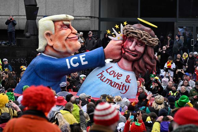 A carnival float designed by German carnival float builder Jacques Tilly featuring US President Donald Trump punching Jesus Christ is pictured during the parade to celebrate Rose Monday (Rosenmontag), on February 16, 2026 in Duesseldorf, western Germany. (Photo by INA FASSBENDER / AFP)