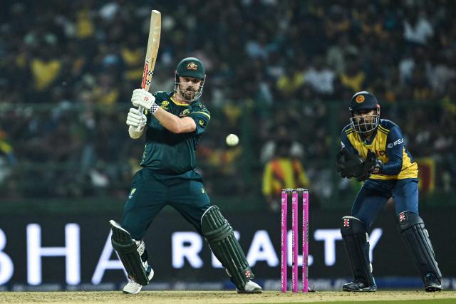 Australia's Travis Head (L) plays a shot during the 2026 ICC Men's T20 Cricket World Cup group stage match between Australia and Sri Lanka at Pallekele International Cricket Stadium in Kandy on February 16, 2026. (Photo by Ishara S. KODIKARA / AFP)