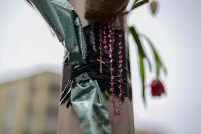 A bouquet of flowers hangs at the site of the brawl that caused the death of Quentin Deranque, a far-right activist a who died after a fatal beating, in Lyon on February 16, 2026. Quentin Deranque, 23, died of his wounds after being attacked on February 12, 2026 on the sidelines of a far-right protest against a left-wing politician speaking at a university in the city of Lyon. The incident has fuelled tension between France's far right and hard left ahead of municipal elections in March and the 2027 presidential race. (Photo by OLIVIER CHASSIGNOLE / AFP)