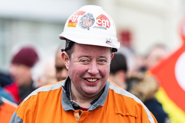 CGT union leader of the French operations of steelmaker ArcelorMittal Dunkerque, Gaetan Lecocq, takes part in a rally on the eve of the formal submission of takeover offers for glassmaking giant Arc in Arques, northern France, on February 16, 2026. Around 500 Arc employees and political figures demonstrated in Arques (Pas-de-Calais) on February 16, 2026, on the eve of the deadline for submitting takeover bids for the glassmaker, which was placed in receivership in early January. (Photo by Sameer Al-DOUMY / AFP)