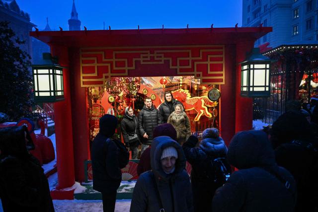 People gather to celebrate the eve of the Lunar New Year of the Horse at Moscow's Manezhnaya Square on February 16, 2026. (Photo by HECTOR RETAMAL / AFP)