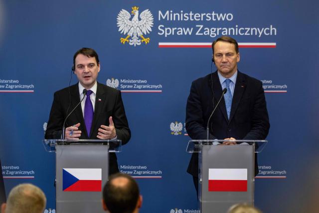 Czech Republic's Foreign Minister Petr Macinka (L) and Poland's Deputy Prime Minister and Foreign Affairs Minister Radoslaw Sikorski  attend a join press conference after their meeting at the ministry building in Warsaw on February 16, 2026. (Photo by Wojtek RADWANSKI / AFP)