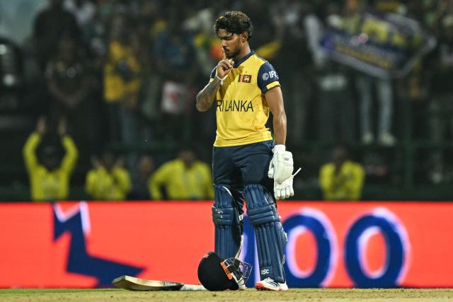 TOPSHOT - Sri Lanka's Pathum Nissanka celebrates after scoring a century (100 runs) during the 2026 ICC Men's T20 Cricket World Cup group stage match between Australia and Sri Lanka at Pallekele International Cricket Stadium in Kandy on February 16, 2026. (Photo by Ishara S. KODIKARA / AFP)