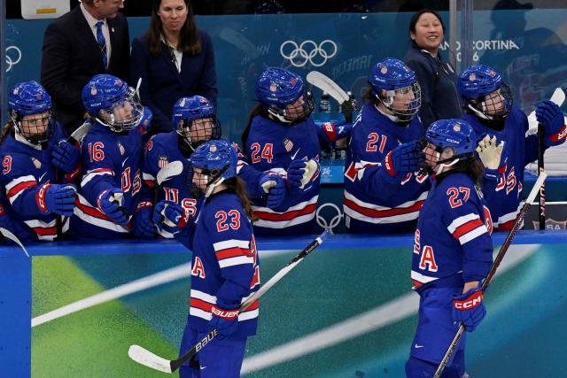 USA's forward #27 Taylor Heise (R) celebrates with teammates after scoring her team's second goal during the women's play-off semi-final ice hockey match between USA and Sweden at the Milano Santagiulia Ice Hockey Arena during the Milano Cortina 2026 Winter Olympic Games in Milan, on February 16, 2026. (Photo by Alexander NEMENOV / AFP)
