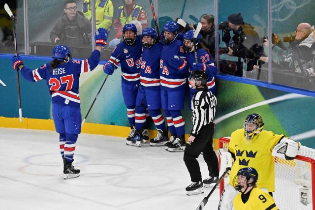 USA's forward #37 Abbey Murphy (2nd L) celebrates with teammates after scoring her team's third goal during the women's play-off semi-final ice hockey match between USA and Sweden at the Milano Santagiulia Ice Hockey Arena during the Milano Cortina 2026 Winter Olympic Games in Milan, on February 16, 2026. (Photo by Alexander NEMENOV / AFP)
