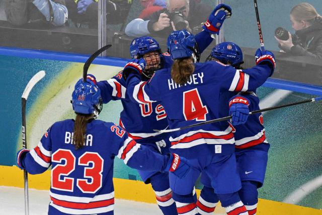 USA's forward #37 Abbey Murphy (unseen) celebrates with teammates after scoring her team's third goal during the women's play-off semi-final ice hockey match between USA and Sweden at the Milano Santagiulia Ice Hockey Arena during the Milano Cortina 2026 Winter Olympic Games in Milan, on February 16, 2026. (Photo by Alexander NEMENOV / AFP)