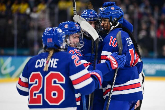 USA's forward #37 Abbey Murphy celebrates with teammates after scoring her team's third goal during the women's play-off semi-final ice hockey match between USA and Sweden at the Milano Santagiulia Ice Hockey Arena during the Milano Cortina 2026 Winter Olympic Games in Milan, on February 16, 2026. (Photo by Piero CRUCIATTI / AFP)