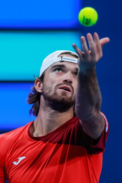 Czech Republic's Tomas Machac serves a ball against Italy's Jannik Sinner during their men’s singles match at the Qatar Open tennis tournament in Doha on February 16, 2026. (Photo by Karim JAAFAR / AFP)