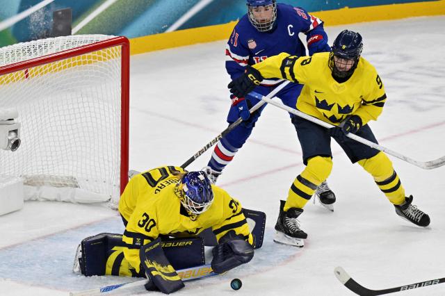 Sweden's #30 Emma Soderberg makes a save during the women's play-off semi-final ice hockey match between USA and Sweden at the Milano Santagiulia Ice Hockey Arena during the Milano Cortina 2026 Winter Olympic Games in Milan, on February 16, 2026. (Photo by Alexander NEMENOV / AFP)