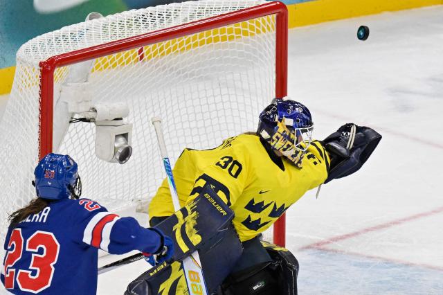 Sweden's #30 Emma Soderberg makes a save during the women's play-off semi-final ice hockey match between USA and Sweden at the Milano Santagiulia Ice Hockey Arena during the Milano Cortina 2026 Winter Olympic Games in Milan, on February 16, 2026. (Photo by Alexander NEMENOV / AFP)