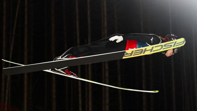 Japan's Ren Nikaido jumps during the 1st round of the men's large hill super team ski jumping of the Milano Cortina 2026 Winter Olympic Games at Predazzo Ski Jumping Stadium in Predazzo (Val di Fiemme), on February 16, 2026. (Photo by Anne-Christine POUJOULAT / AFP)