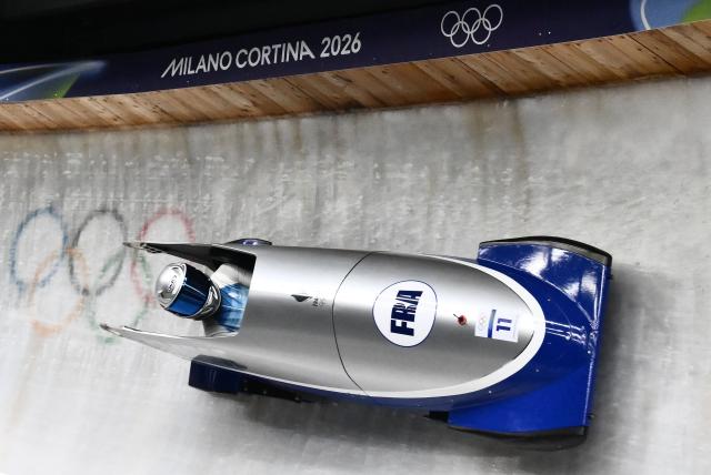 France's Margot Boch competes in the bobsleigh women's monobob heat 3 at Cortina Sliding Centre during the Milano Cortina 2026 Winter Olympic Games in Cortina d'Ampezzo on February 16, 2026. (Photo by Marco BERTORELLO / AFP)