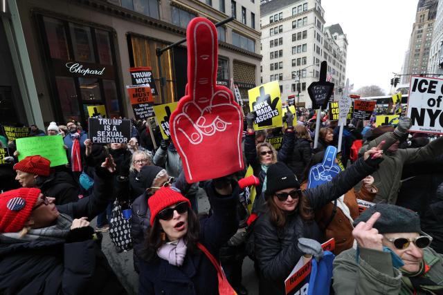 EDITORS NOTE: Graphic content / People gather during a flash-mob on President's Day in front of Trump Tower in New York, on February 16, 2026. (Photo by TIMOTHY A.CLARY / AFP)