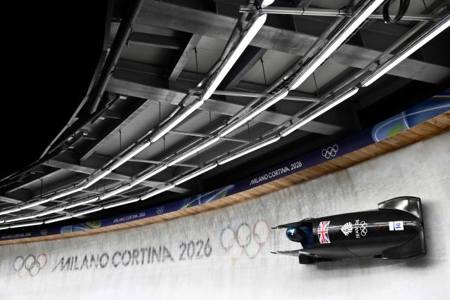 Britain's Adele Nicoll competes in the bobsleigh women's monobob heat 3 at Cortina Sliding Centre during the Milano Cortina 2026 Winter Olympic Games in Cortina d'Ampezzo on February 16, 2026. (Photo by Marco BERTORELLO / AFP)