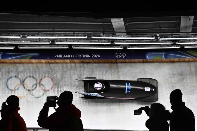 Taiwan's Lin Sin-rong competes in the bobsleigh women's monobob heat 3 at Cortina Sliding Centre during the Milano Cortina 2026 Winter Olympic Games in Cortina d'Ampezzo on February 16, 2026. (Photo by Marco BERTORELLO / AFP)