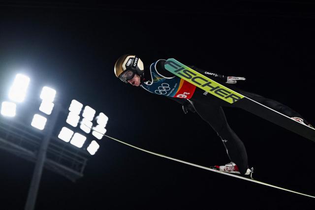 France's Jules Chervet jumps during the 1st round of the men's large hill super team ski jumping of the Milano Cortina 2026 Winter Olympic Games at Predazzo Ski Jumping Stadium in Predazzo (Val di Fiemme), on February 16, 2026. (Photo by Javier SORIANO / AFP)