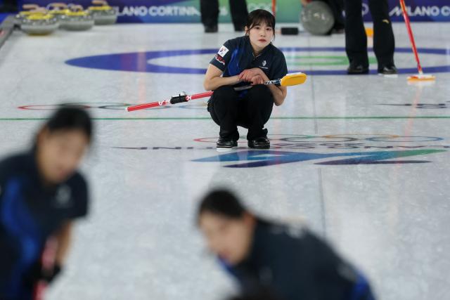 South Korea's Seol Yeeun competes in the curling women's round robin between South Korea and China during the Milano Cortina 2026 Winter Olympic Games at the Cortina Curling Olympic Stadium in Cortina d’Ampezzo on February 16, 2026. (Photo by Odd ANDERSEN / AFP)